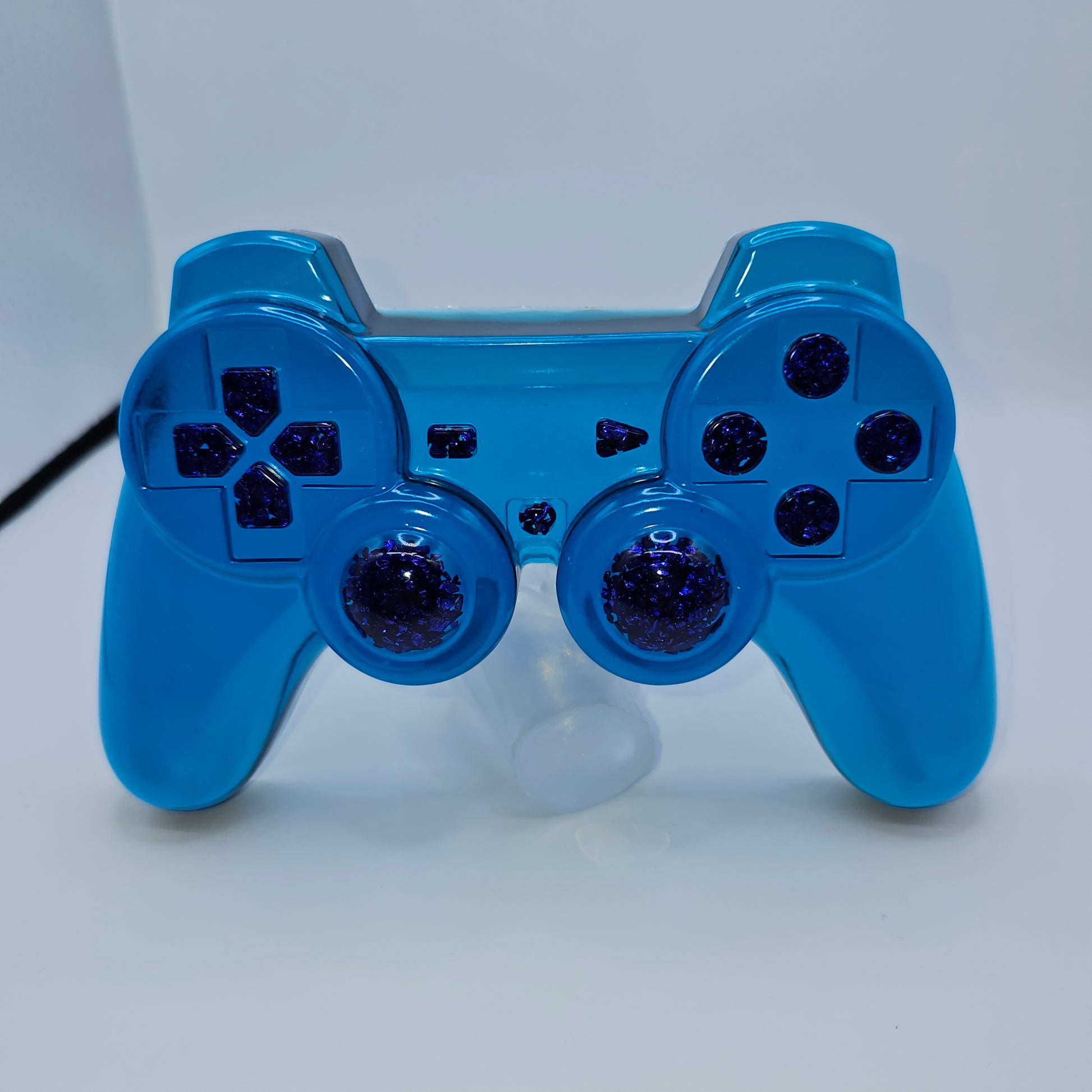Manette type playstation bleu avec effet diamant